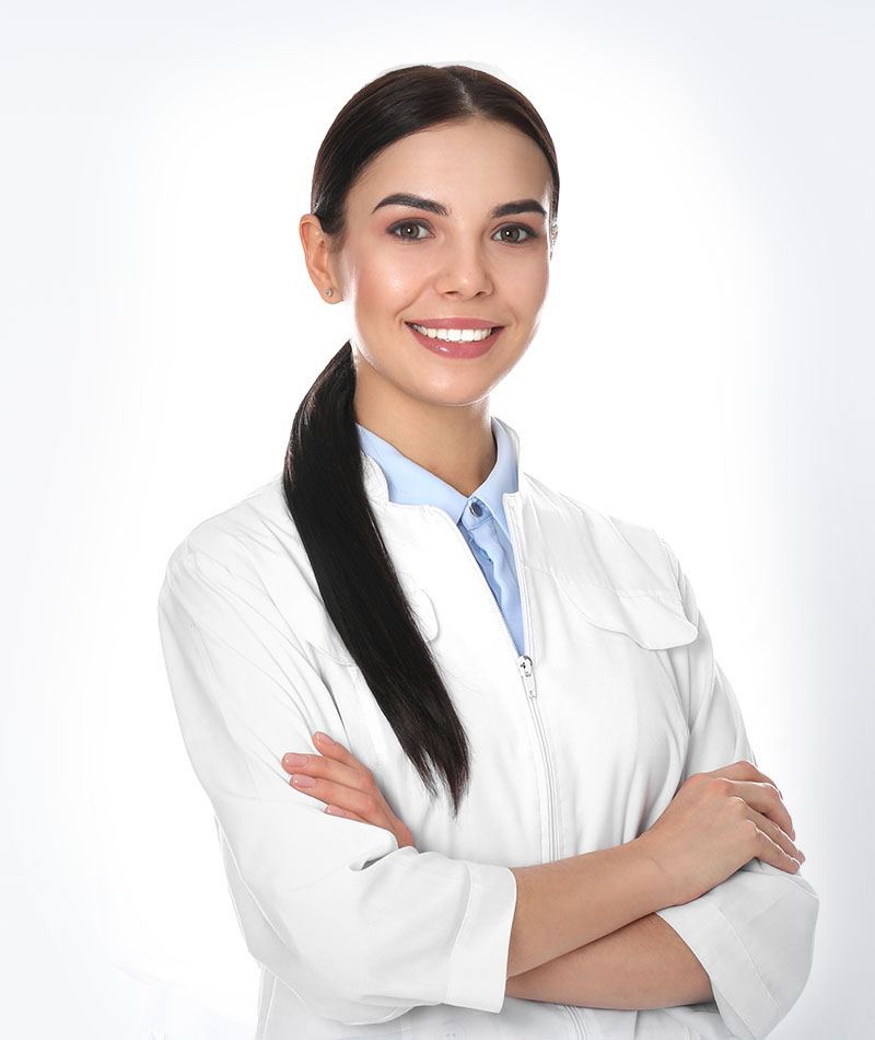 Happy young woman in lab coat on white background