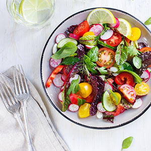 Salad with fresh summer vegetables, top view