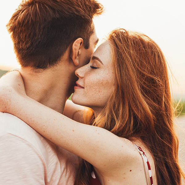 Honeymoon couple kissing